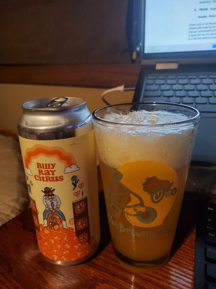 Can of Billy Ray Cyrus Next to Glass with Beer