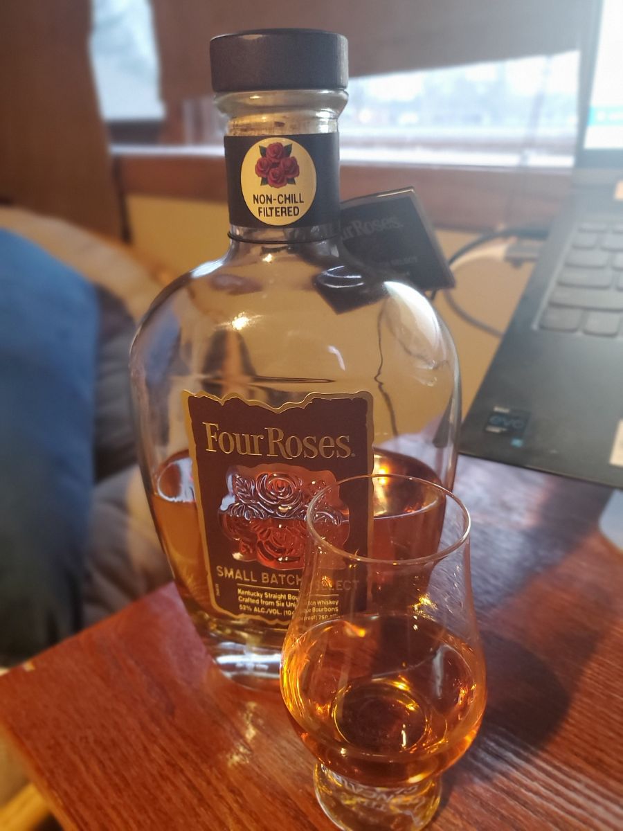 Bottle of Four Roses Small Batch Select Bourbon and Full Glass