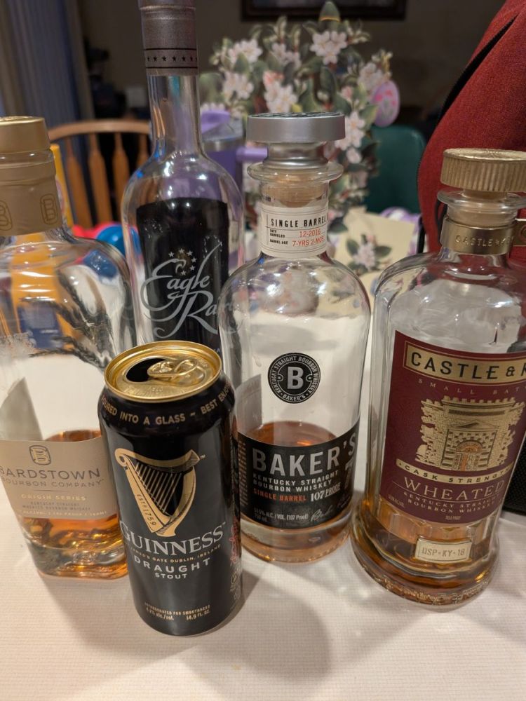 Whiskey Bottles and Guinness Can on a Counter